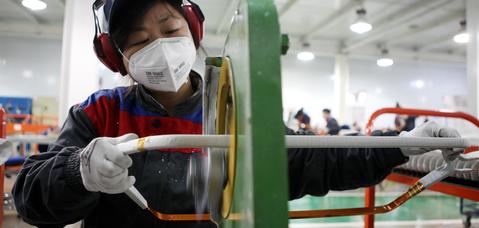 LI Hongying doing the machine insulation of KAZAK4 coil in coil line, Xi’an Alstom Yongji Electric Equipment Co., Ltd., Xayeeco, China, Feb 21, 2014