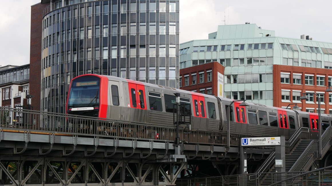 Hamburg Metro DT5 on viaduct leaving the elevated railway station Baumwall in Hamburg- Germany