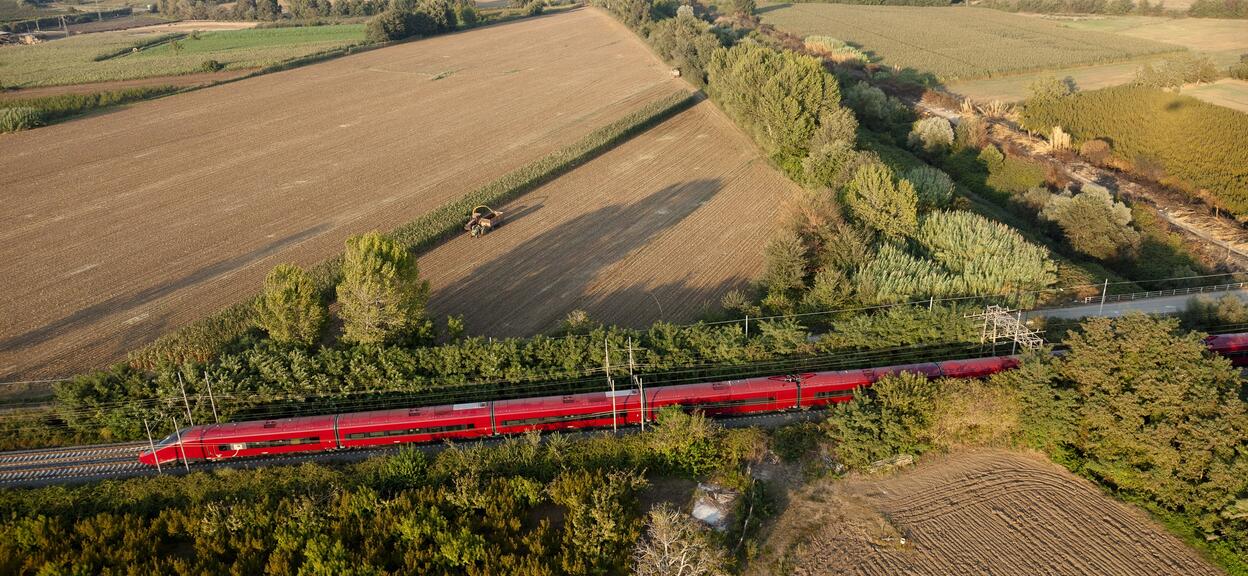 Aerial shooting of Italo train in dynamic tests on track line between Nola and Roma, Italy