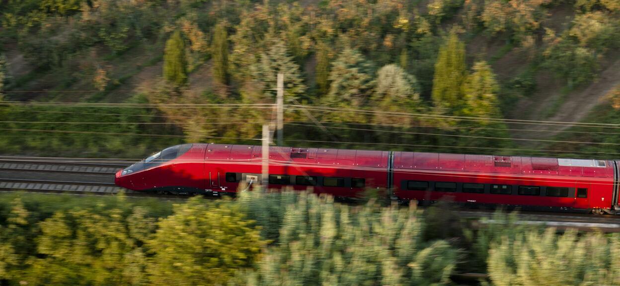 Aerial shooting of Italo train in dynamic tests on track line between Nola and Roma, Italy