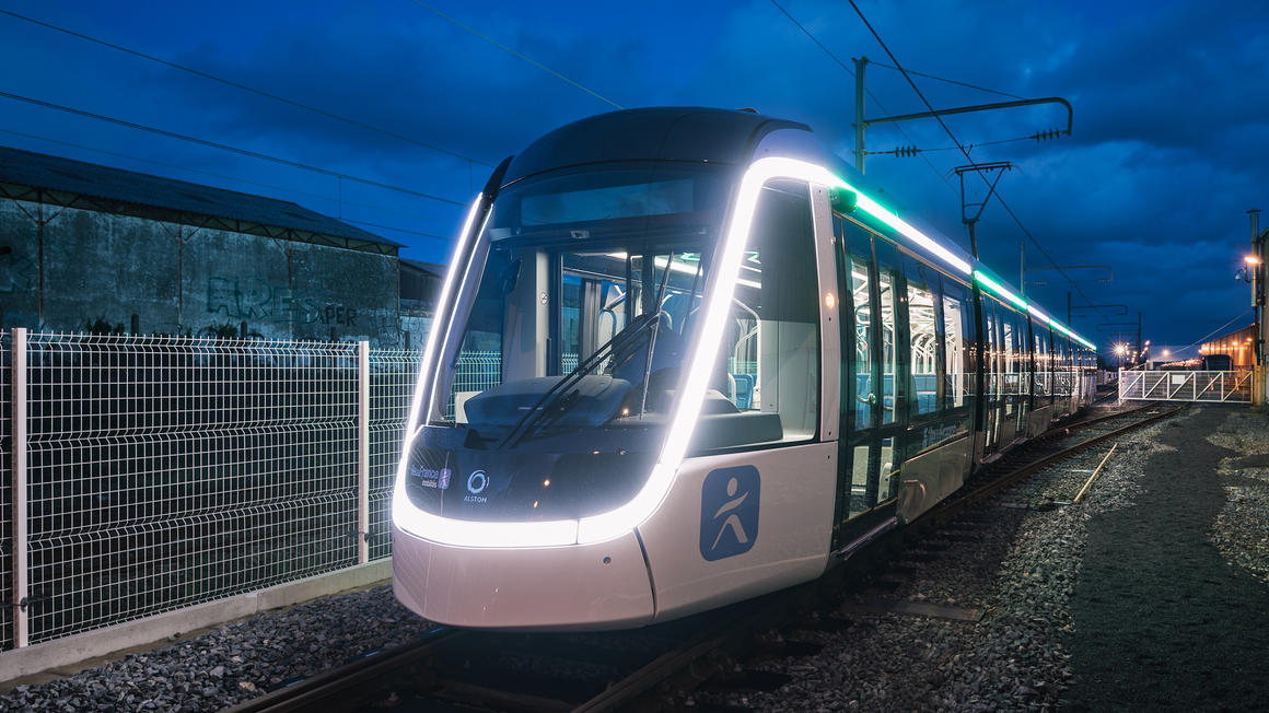 Copyright Alstom TOMA | Thibaut Priou (Ref 161558) 3⁄4 Front view of the Citadis T9 Tramway with IDFM logo and exterior lightning signature. La Rochelle. France. November 2019.