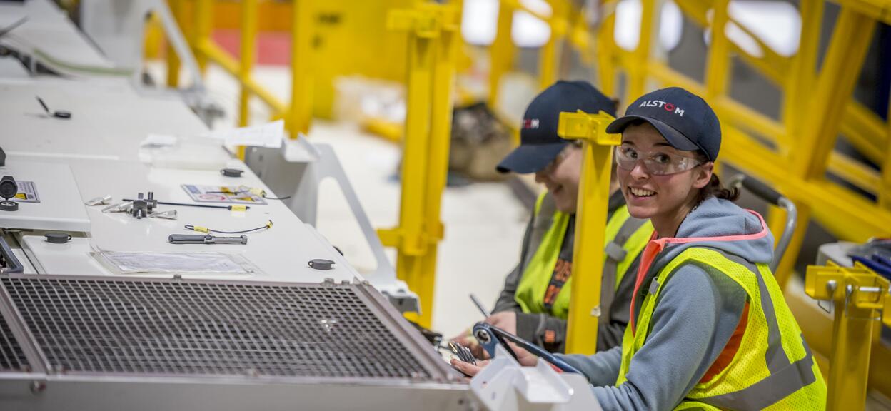 Workers completing the cabling routing on the roof of the Ottawa Citadis Spirit. Hornell, USA, February 2016