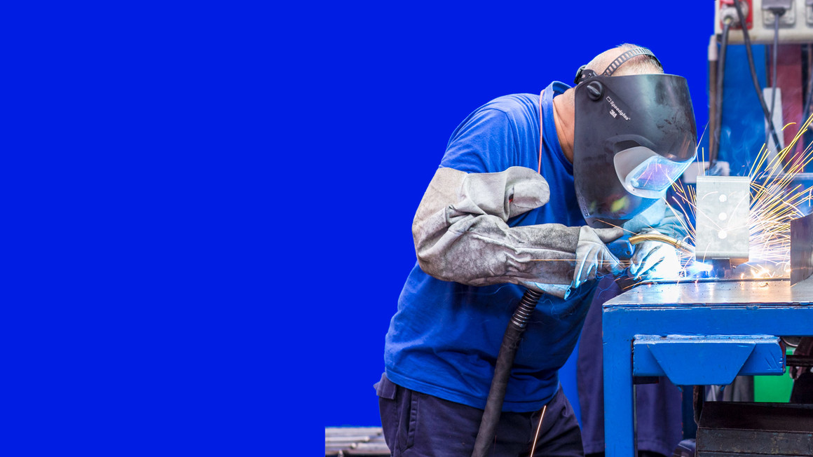 Copyright: Margon Man making a weld in a factory