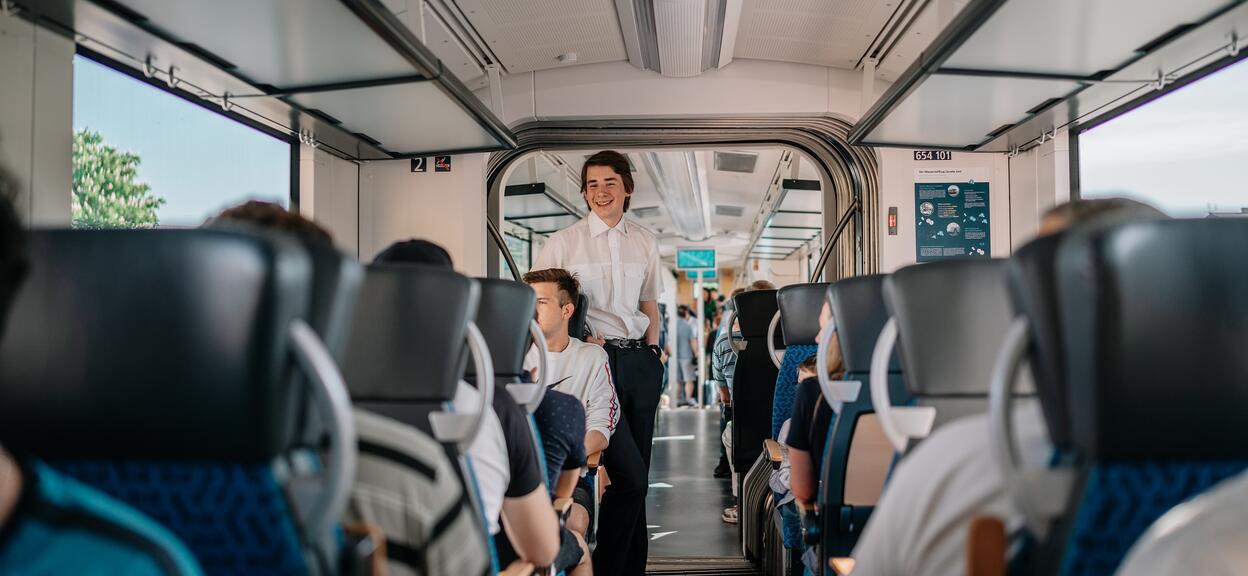 Czechia Hydrogen Railshow smiling Czech passenger May 2022.jpg