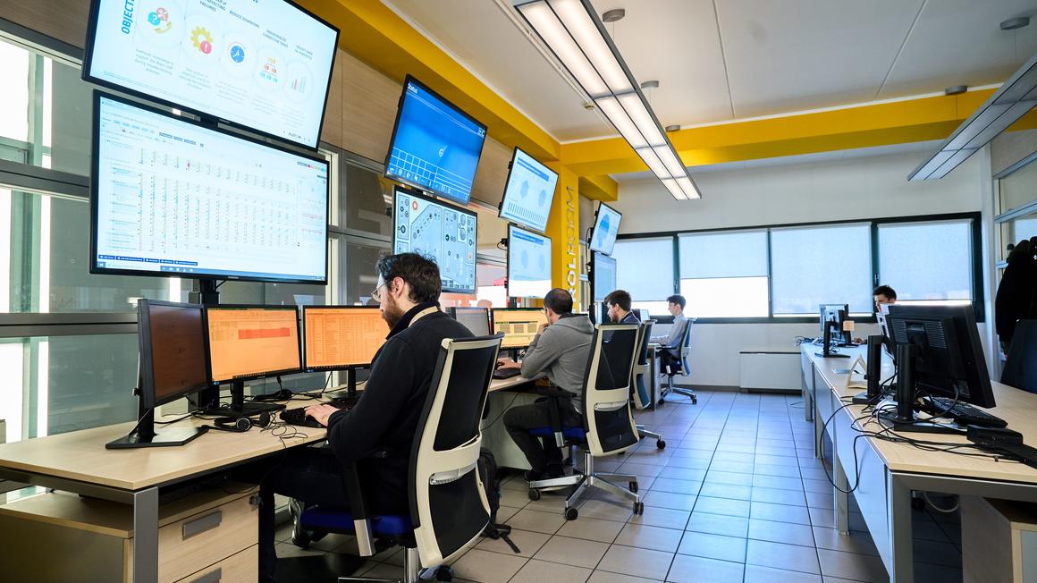 Control room with engineers working at screens