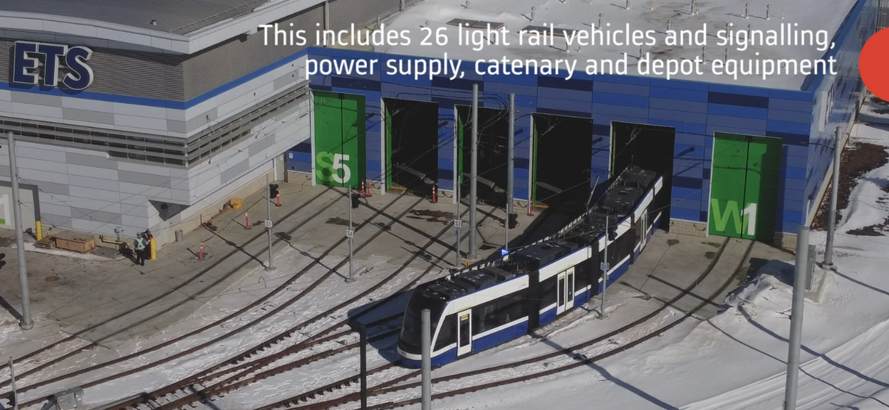 Light rail vehicle leaving depot on tracks