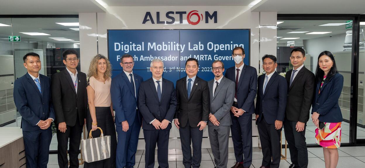 People standing in front of Alstom Digital Mobility Lab opening