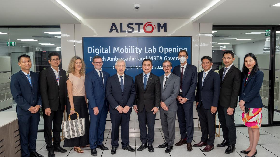 People standing in front of Alstom Digital Mobility Lab opening