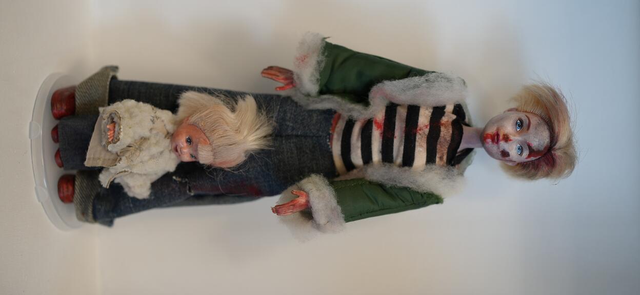 Barbie doll displayed on wall