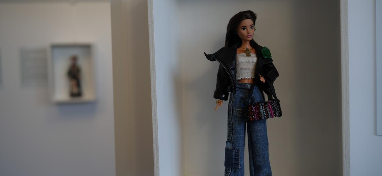 Barbie doll displayed on wall