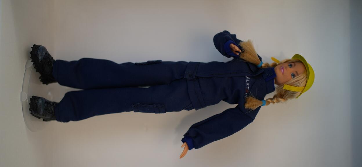 Barbie doll displayed on wall