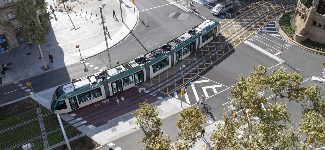 Alstom Citadis Trams running on the new APS infrastructure in Barcelona. The new tracks connect the two tram networks in the city through the Diagonal avenue, one of the most iconic streets of the city.