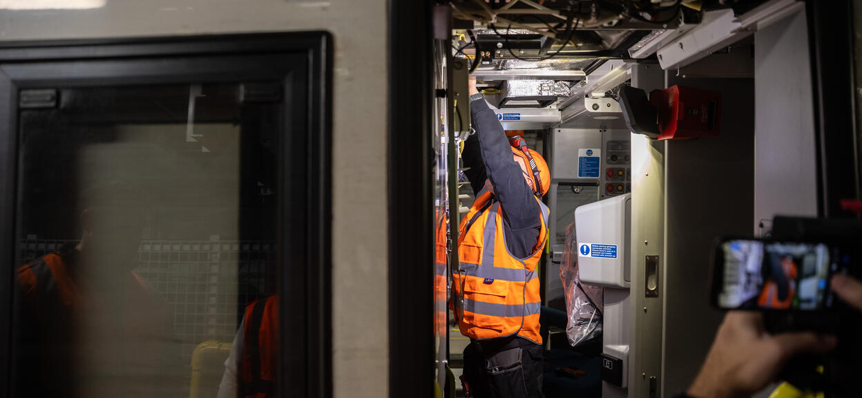 Engineer working on a train for Project Aurora