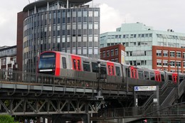 Hamburg Metro DT5 on viaduct leaving the elevated railway station Baumwall in Hamburg- Germany