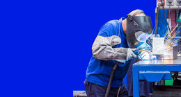 Man making a weld in a factory