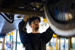 Alstom employee works on a train in maintenance depot