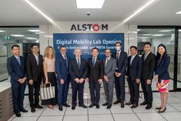 People standing in front of Alstom Digital Mobility Lab opening