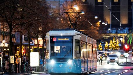 Flexity light rail tram at night on street in Gothenburg, Sweden