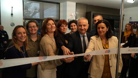 Alstom Italia employees cutting ribbon for LAUGH! opening
