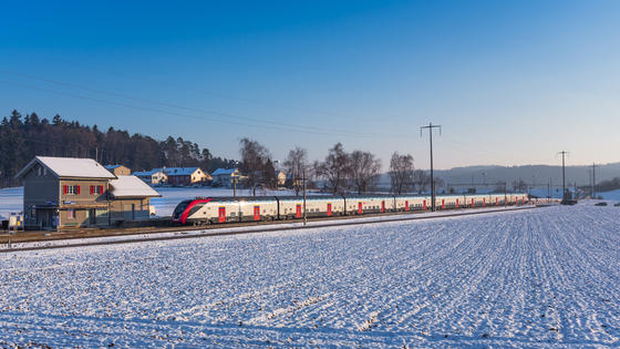 © ALSTOM SA 2016. Daniel Wipf Twindexx Swiss Express (Electric multiple unit (EMU)) - Switzerland in snowy winter landscape. Double-deck train for SBB CFF FFS (Swiss Federal Railways)