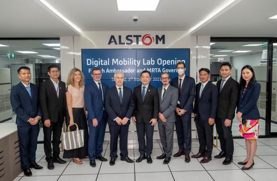 People standing in front of Alstom Digital Mobility Lab opening