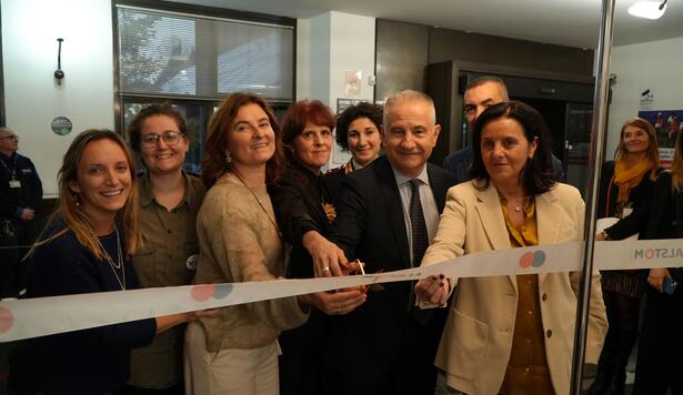 Alstom Italia employees cutting ribbon for LAUGH! opening