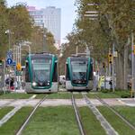 Citadis Trams running on the new APS infrastructure in Barcelona. The new tracks connect the two tram networks in the city through the Diagonal avenue, one of the most iconic streets of the city.