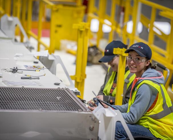 Workers completing the cabling routing on the roof of the Ottawa Citadis Spirit. Hornell, USA, February 2016
